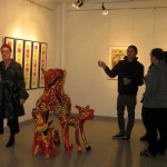 Delegates appreciate an art exhibition and paper presentation at the Newcastle conference